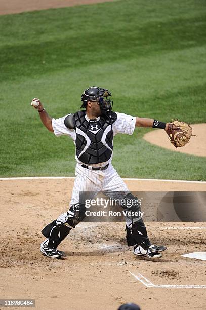 Ramon Castro of the Chicago White Sox throws the ball while catching against the Washington Nationals on June 25, 2011 at U.S. Cellular Field in...