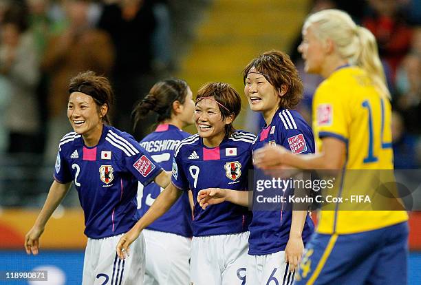 Nahomi Kawasumi of Japan celebrates her second goal against Sweden with Yukari Kinga and Mizuho Sakaguchi during the FIFA Women's World Cup Semi...