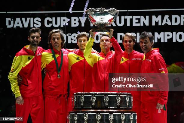 Marcel Granollers, Feliciano Lopez, Pablo Carreno Busta, Roberto Bautista Agut and Rafael Nadal pose for a photo as Roberto Bautista Agut lifts the...