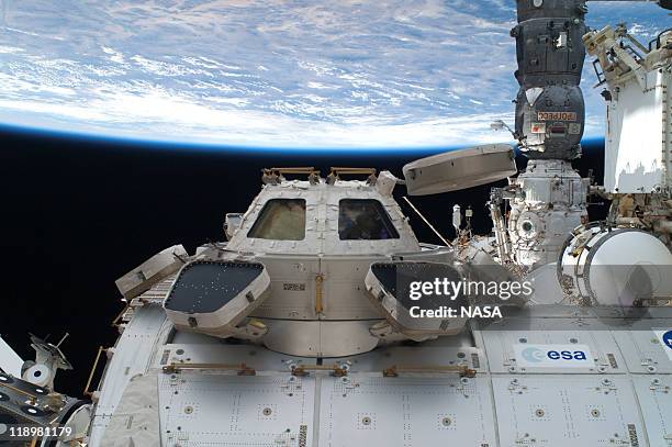 In this handout image provided by the National Aeronautics and Space Administration , the Cupola, backdropped against a solar array panel, on the...