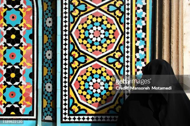 muslim woman is praying in the mosque - religious veil stock pictures, royalty-free photos & images