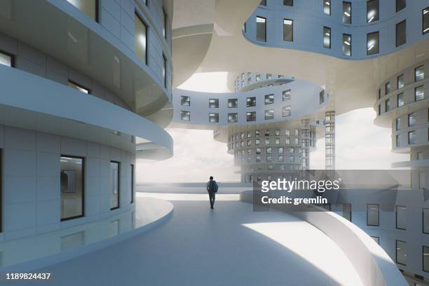 未来のオフィスパークを歩く男 - headquarters ストックフォトと画像