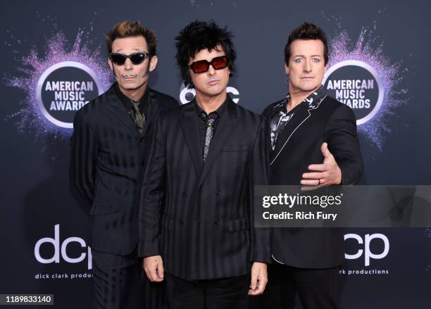 Mike Dirnt, Billie Joe Armstrong, and Tré Cool of Green Day attend the 2019 American Music Awards at Microsoft Theater on November 24, 2019 in Los...