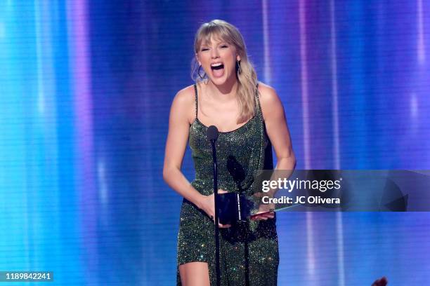 Taylor Swift accepts the Favorite Album - Pop/Rock award for 'Lover' performs onstage during the 2019 American Music Awards at Microsoft Theater on...