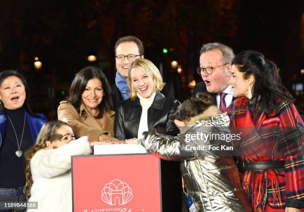 8th district Mayor Jeanne d’Hauteserre , Anne Hidalgo , actress Ludivine Sagnier black jacket and Champs Elysees Comitee President Jean-Noël...