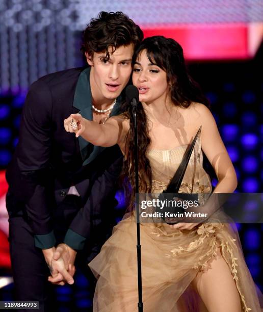 Shawn Mendes and Camila Cabello accept the Collaboration of the Year award for 'Señorita' onstage during the 2019 American Music Awards at Microsoft...