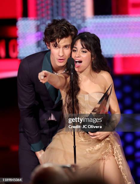 Shawn Mendes and Camila Cabello accept the Collaboration of the Year award for 'Señorita' onstage during the 2019 American Music Awards at Microsoft...