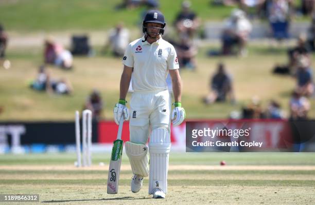 Jos Buttler of England leaves the field after being bowled by Neil Wagner of New Zealand during day five of the first Test match between New Zealand...