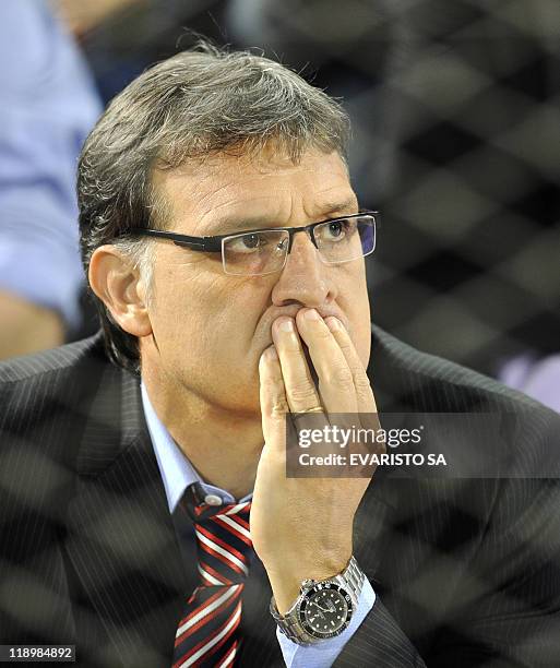 Paraguay's Head coach Gerardo Martino watches their 2011 Copa America Group B first round football match against Venezuela from the stands held at...