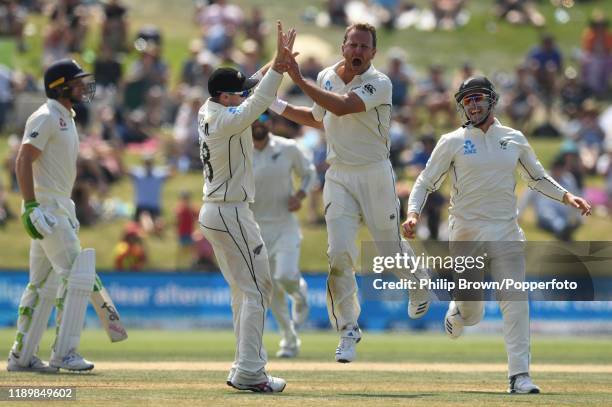 Neil Wagner of New Zealand celebrates after bowling Jos Buttler during day five of the first Test match between New Zealand and England at Bay Oval...