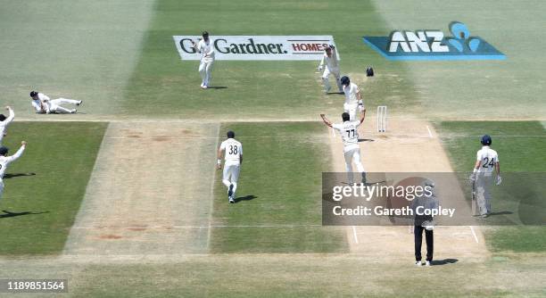 England captain Joe Root is caught out by Tom Latham of New Zealand during day five of the first Test match between New Zealand and England at Bay...