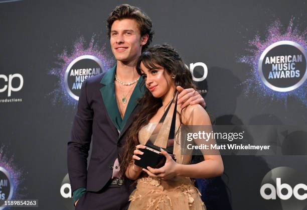 Shawn Mendes and Camila Cabello, winners of the Collaboration of the Year award for 'Señorita,' pose in the press room during the 2019 American Music...