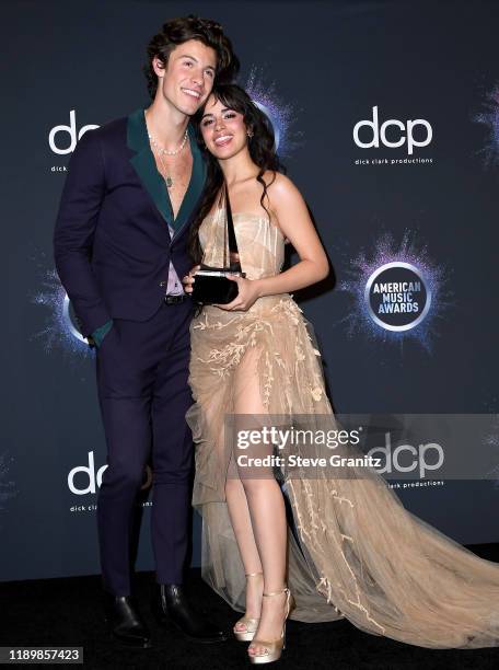 Shawn Mendes and Camila Cabello, winners of the Collaboration of the Year award for 'Señorita,' pose in the press room during the 2019 American Music...