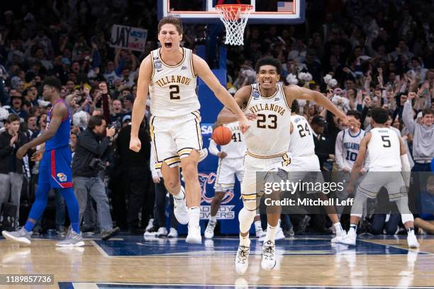 Collin Gillespie and Jermaine Samuels of the Villanova Wildcats react after defeating the Kansas Jayhawks at the Wells Fargo Center on December 21,...