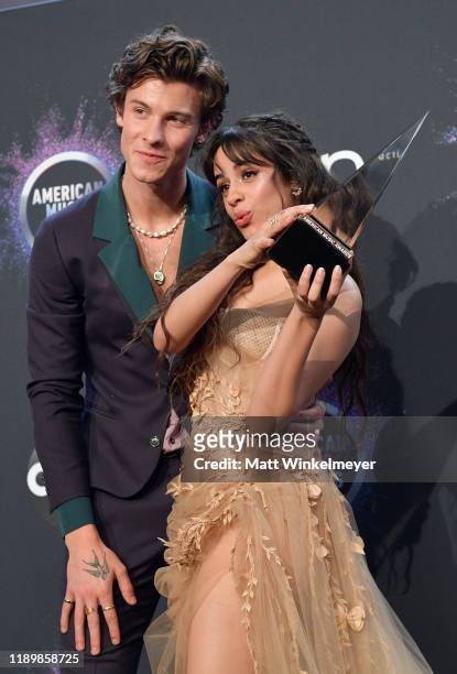 Shawn Mendes and Camila Cabello, winners of the Collaboration of the Year award for 'Señorita,' pose in the press room during the 2019 American Music...