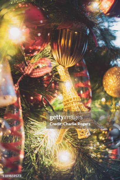 festive decorations on christmas tree - eiffel tower christmas stock pictures, royalty-free photos & images