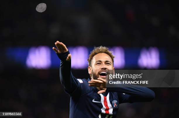 Paris Saint-Germain's Brazilian forward Neymar celebrates his goal during the French L1 football match between Paris Saint-Germain and Amiens at the...