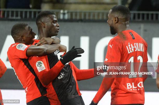 Rennes' Senegalese forward Mbaye Niang celebrates with teammates after scoring a goal during the French L1 football match between Stade Rennais...