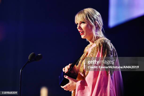 Taylor Swift accepts the Artist of the Year award onstage during the 2019 American Music Awards at Microsoft Theater on November 24, 2019 in Los...