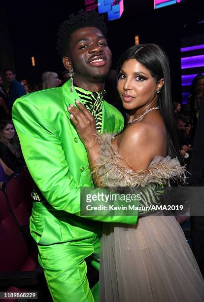 Lil Nas X and Toni Braxton pose backstage during the 2019 American Music Awards at Microsoft Theater on November 24, 2019 in Los Angeles, California.