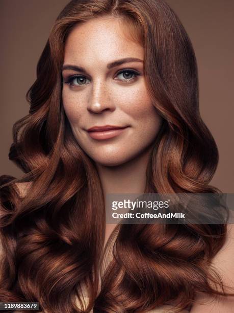 young beautiful model with long wavy well groomed hair - dyed red hair imagens e fotografias de stock