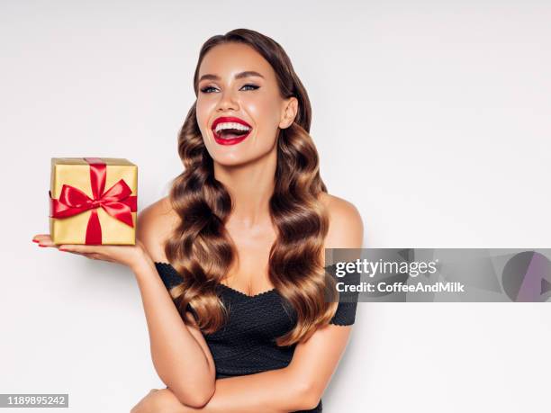 beautiful woman with present - glamour presents stock pictures, royalty-free photos & images