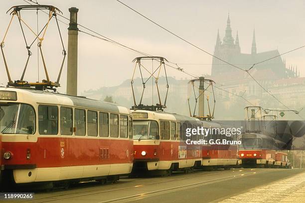 tram in prague with castle in distance - hradcany castle stock pictures, royalty-free photos & images