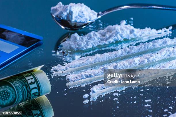 lines of cocaine on a mirror surface. - cocaine stock pictures, royalty-free photos & images
