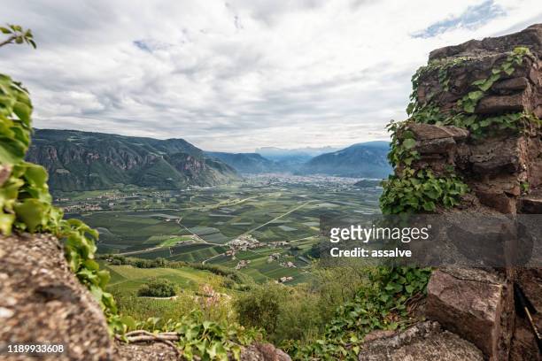 hiking in alto adige, italy, with city bolzano in the background - alto adige stock pictures, royalty-free photos & images
