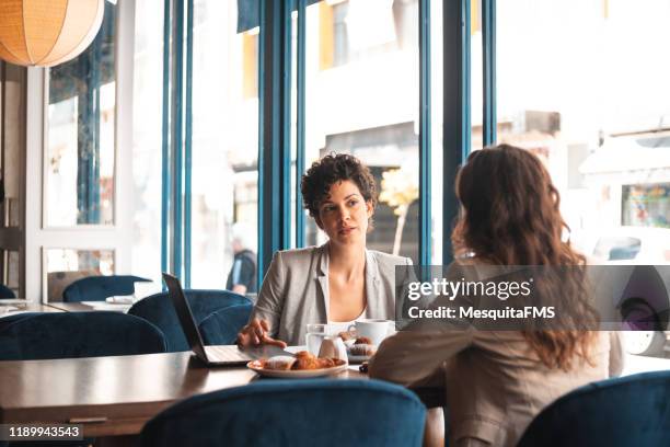 business meeting at cafe - women business lunch stock pictures, royalty-free photos & images