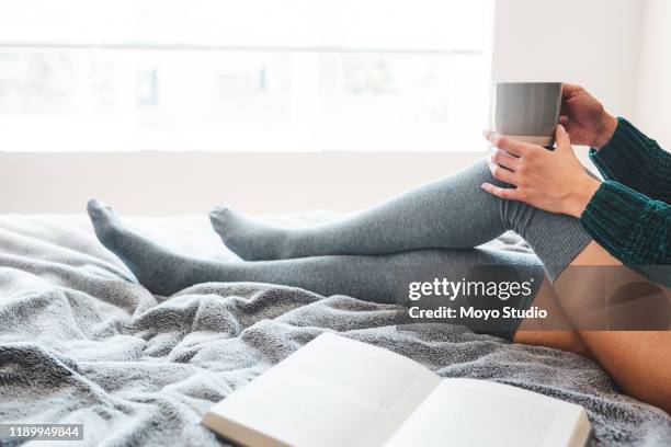 grab a coffee and a book and enjoy life - knee length stock pictures, royalty-free photos & images
