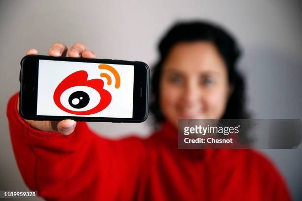 In this photo illustration, the Weibo logo is displayed on the screen of an iPhone on November 25, 2019 in Paris, France. Weibo is a Chinese...