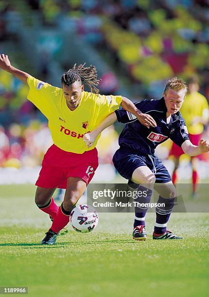 Nordin Wooter of Watford and Dean Keates of Walsall challenge for the ball during the Nationwide Division One match played at Vicarage Road in...