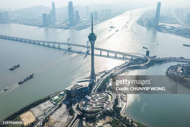 macau tower convention and city skyline - macao stock pictures, royalty-free photos & images