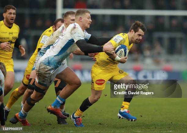 Arthur Retiere of La Rochelle is tackled by Rob du Preez during the Heineken Champions Cup Round 2 match between Sale Sharks and La Rochelle at AJ...