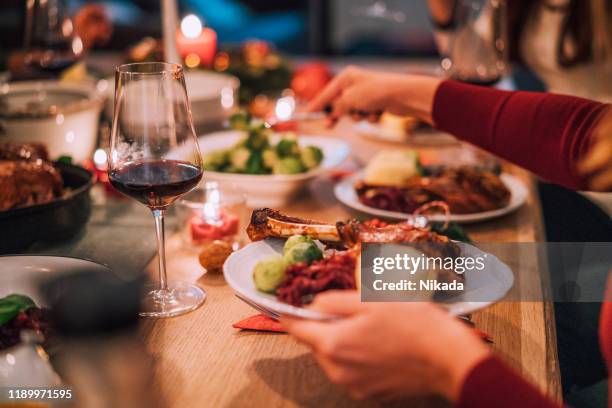 traditional german holiday goose dinner with dumplings and red cabbage - gandee stock pictures, royalty-free photos & images