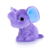 Elephant plushie doll isolated on white background with shadow reflection. Plush stuffed puppet on white backdrop. Purple or violet fluffy elephant toy for children. Cute furry animal plaything.