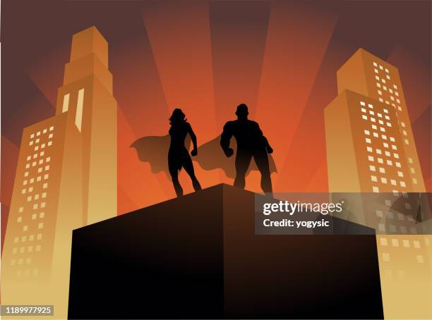 vector superhero couple on a rooftop with art deco building backgound - 1940s couple stock illustrations