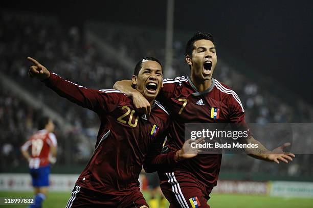 Grenddy Perozo and Nicolas Fedor of Venezuela celebrate a goal during a match against Paraguay as part of the Copa America 2011 at "Padre Ernesto...