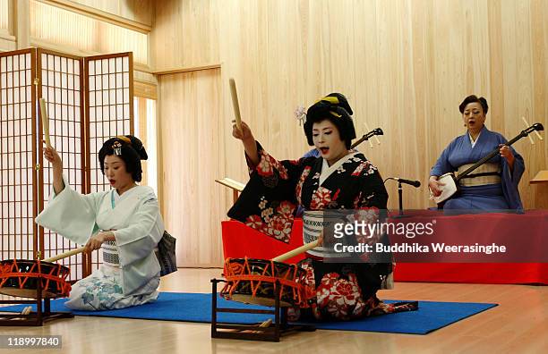 Geisha perform traditional Taiko drum during the special event for the local tourist to make them familiar with geisha on July 13, 2011 in Awara...