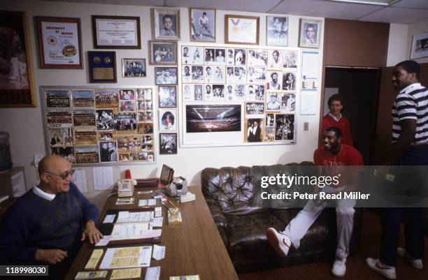 Portrait of UNLV coach Jerry Tarkanian with players Eldridge Hudson and John Flowers in his office at Thomas & Mack Center. Las Vegas, NV 2/9/1984...