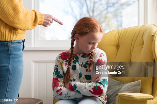 10-year-old girl being reprimanded by her parent - sad 10 year girl stock pictures, royalty-free photos & images