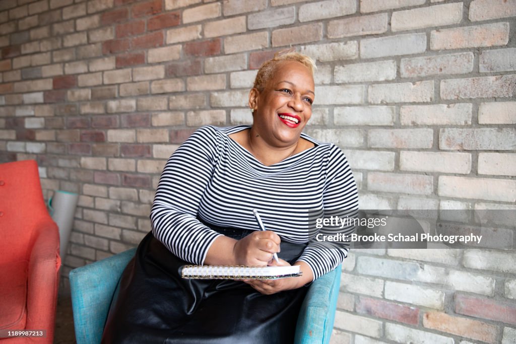 Older Black woman in a cafe