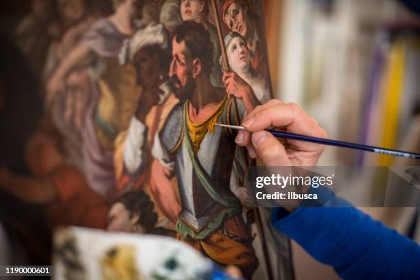 restorer and framer laboratory craftswomen: restoring antique religious painting canvas - restoring stock pictures, royalty-free photos & images