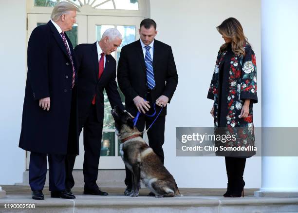 President Donald Trump, Vice President Mike Pence and first lady Melania Trump pose for photographs with Conan, the U.S. Military K9 that assisted in...