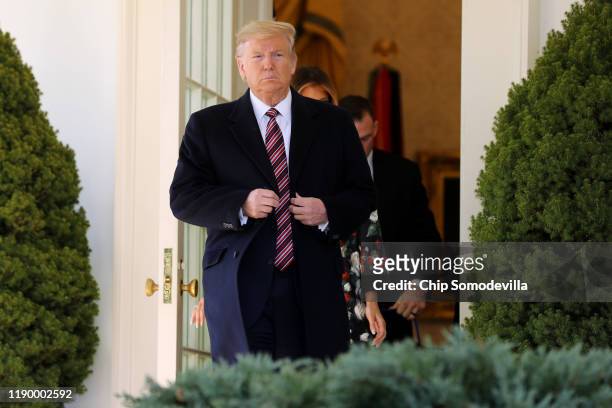 President Donald Trump steps out of the Oval Office before posing for photographs with Conan, the U.S. Military K9 that assisted in the raid that...