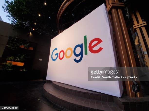 Wide angle of large conference display with logo for Google Inc at night, Los Angeles, California, October 28, 2019.