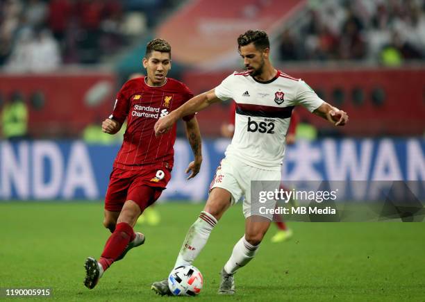 Pablo Mari of CR Flamengo competes for the ball with Roberto Firmino of Liverpool during the FIFA Club World Cup Final Match between Liverpool FC and...