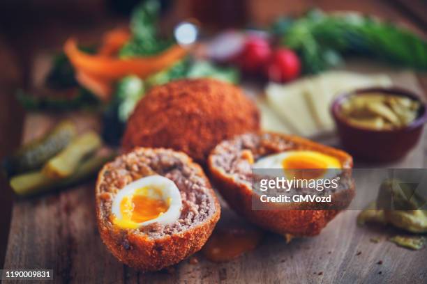 british scotch eggs with mustard - scotch egg stock pictures, royalty-free photos & images