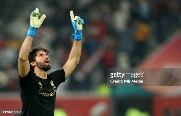 Alisson of Liverpool celebrates after the victory goal of Roberto Firmino ,during the FIFA Club World Cup Final Match between Liverpool FC and CR...